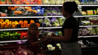 Shoppers browse the produce section at a Target store, Aug. 13, 2026, Woodbury, Minn.