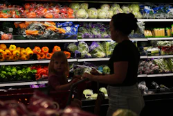 Shoppers browse the produce section at a Target store, Aug. 13, 2026, Woodbury, Minn.