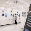 An Apple employee watches a machine in a learning lab at Apple's Advanced Manufacturing Center, Houston, Aug. 13, 2026.