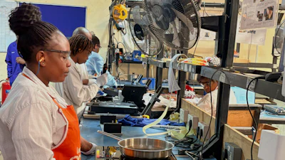 Workers assemble fuel-efficient cookstoves at BURN, a manufacturer of clean cooking appliances, Kiambu, Kenya, July 31, 2026.