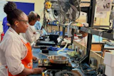 Workers assemble fuel-efficient cookstoves at BURN, a manufacturer of clean cooking appliances, Kiambu, Kenya, July 31, 2026.