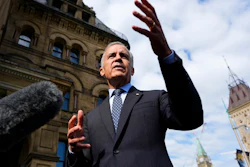 Canadian Prime Minister Mark Carney speaks to journalists as he arrives at the Office of the Prime Minister and Privy Council in Ottawa, Sept. 1, 2026.