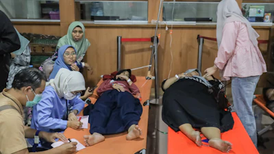 Students who fell ill, allegedly due to food poisoning after consuming free meals at their school, receive medical treatment at a hospital in Sidoarjo, East Java, Indonesia, Sept. 2, 2026.