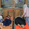 Students who fell ill, allegedly due to food poisoning after consuming free meals at their school, receive medical treatment at a hospital in Sidoarjo, East Java, Indonesia, Sept. 2, 2026.