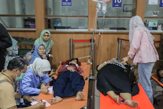 Students who fell ill, allegedly due to food poisoning after consuming free meals at their school, receive medical treatment at a hospital in Sidoarjo, East Java, Indonesia, Sept. 2, 2026.