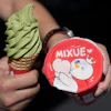 A customer holds an ice cream cone outside of a Mixue store, Sept. 16, 2026, Sunnyvale, Calif.