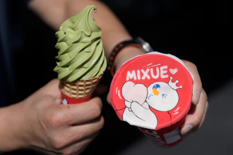 A customer holds an ice cream cone outside of a Mixue store, Sept. 16, 2026, Sunnyvale, Calif.