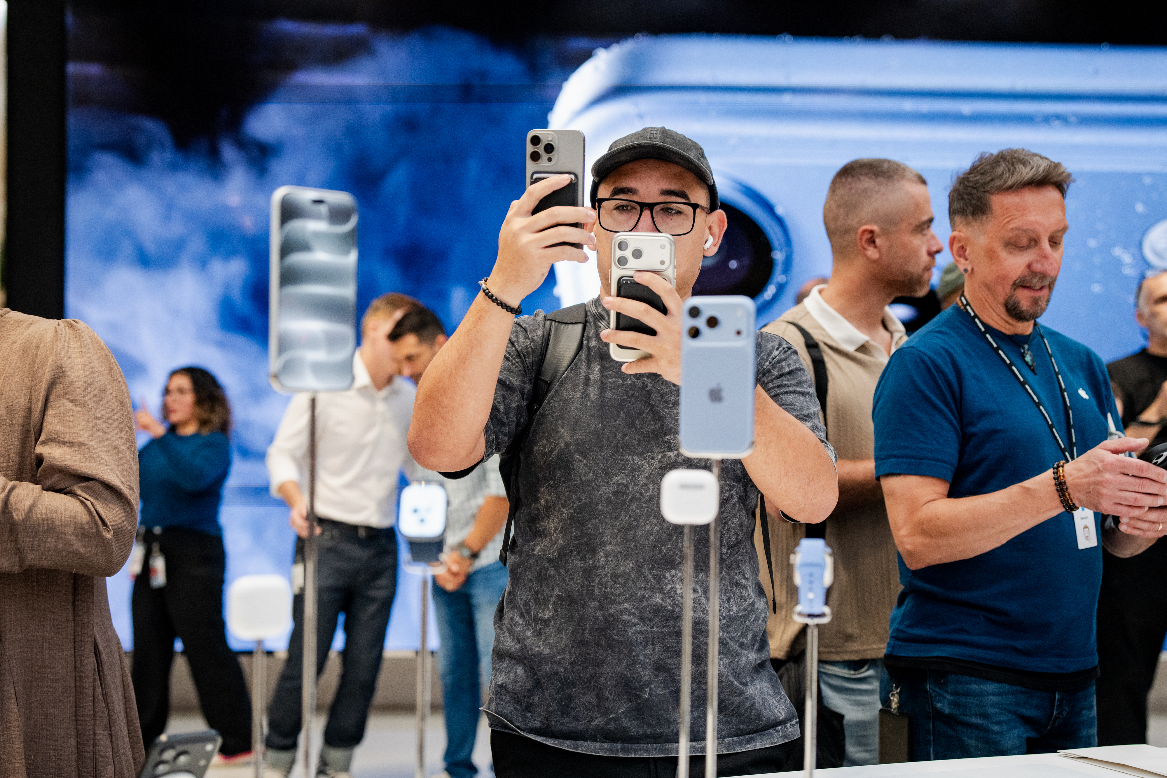 People shop at the Apple store on Fifth Avenue on the day of Apple's launch of the iPhone 18 Pro, Sept. 18, 2026, New York.