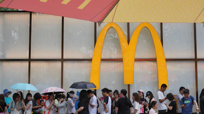 People line up to enter a McDonald's restaurant in Beijing, Aug. 20, 2025.