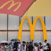 People line up to enter a McDonald's restaurant in Beijing, Aug. 20, 2025.
