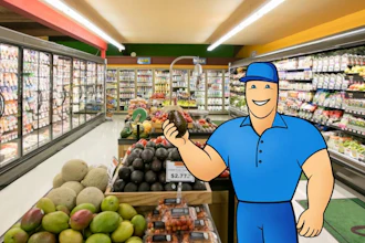 Friendly grocery store worker in blue uniform smiling in supermarket aisle with refrigerated cases and fresh produce displays