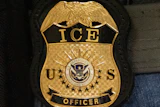 U.S. Immigration and Customs Enforcement officer badge featuring gold eagle, shield, and Department of Homeland Security seal on uniform