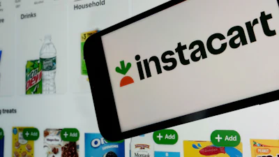 An Instacart logo and webpage are seen in New York, Sept. 6, 2023.