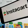 An Instacart logo and webpage are seen in New York, Sept. 6, 2023.