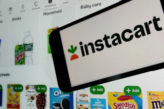 An Instacart logo and webpage are seen in New York, Sept. 6, 2023.