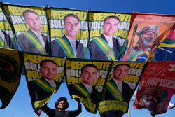 A street vendor sells campaign flags of presidential candidates Sen. Flavio Bolsonaro and current President Luiz Inacio Lula da Silva, Brasilia, Brazil, Sept. 29, 2026.