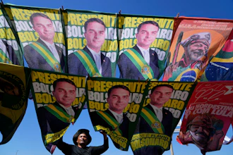 A street vendor sells campaign flags of presidential candidates Sen. Flavio Bolsonaro and current President Luiz Inacio Lula da Silva, Brasilia, Brazil, Sept. 29, 2026.
