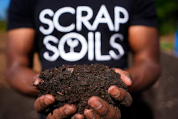 Ricky Blanding, founder of Scrap Soils, holds composted soil at Sanctuary Farms, Sept. 14, 2026, Detroit.