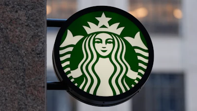 The Starbucks logo is displayed on a coffee shop, Nov. 24, 2025, Boston.