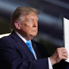 President Donald Trump displays a signed executive order at a campaign rally at the Pinnacle Bank Expo Center, Oct. 5, 2026, Grand Island, Neb.