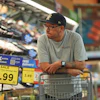 A shopper looks the meat section of a grocery story in Fort Worth, Texas, Oct. 7, 2026.