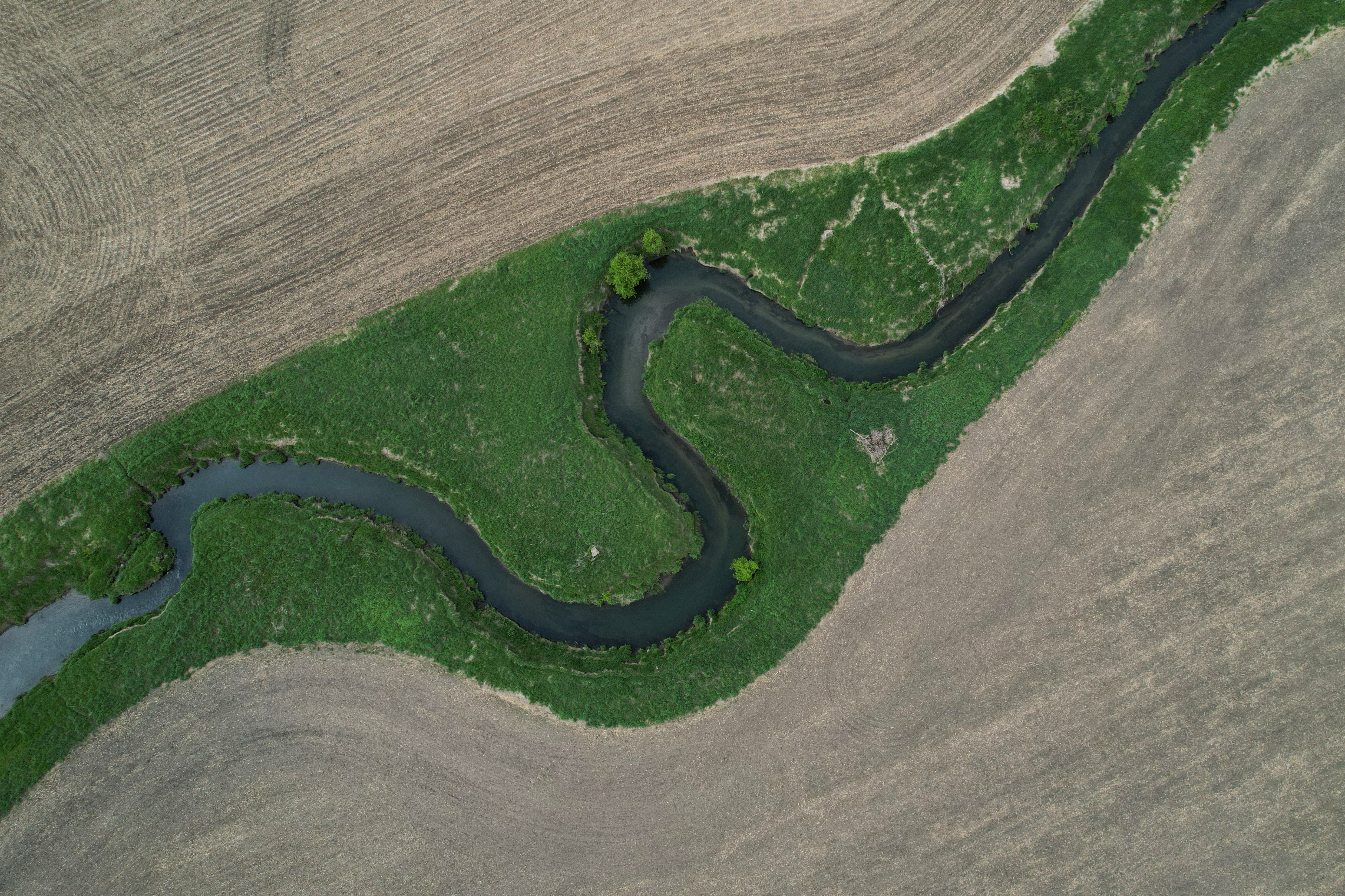 A stream cuts through a farm field near Marshalltown, Iowa, May 7, 2026.