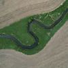 A stream cuts through a farm field near Marshalltown, Iowa, May 7, 2026.