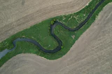 A stream cuts through a farm field near Marshalltown, Iowa, May 7, 2026.