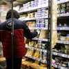 A worker restocking products in a supermarket in Montreuil, France, Oct. 14, 2026.