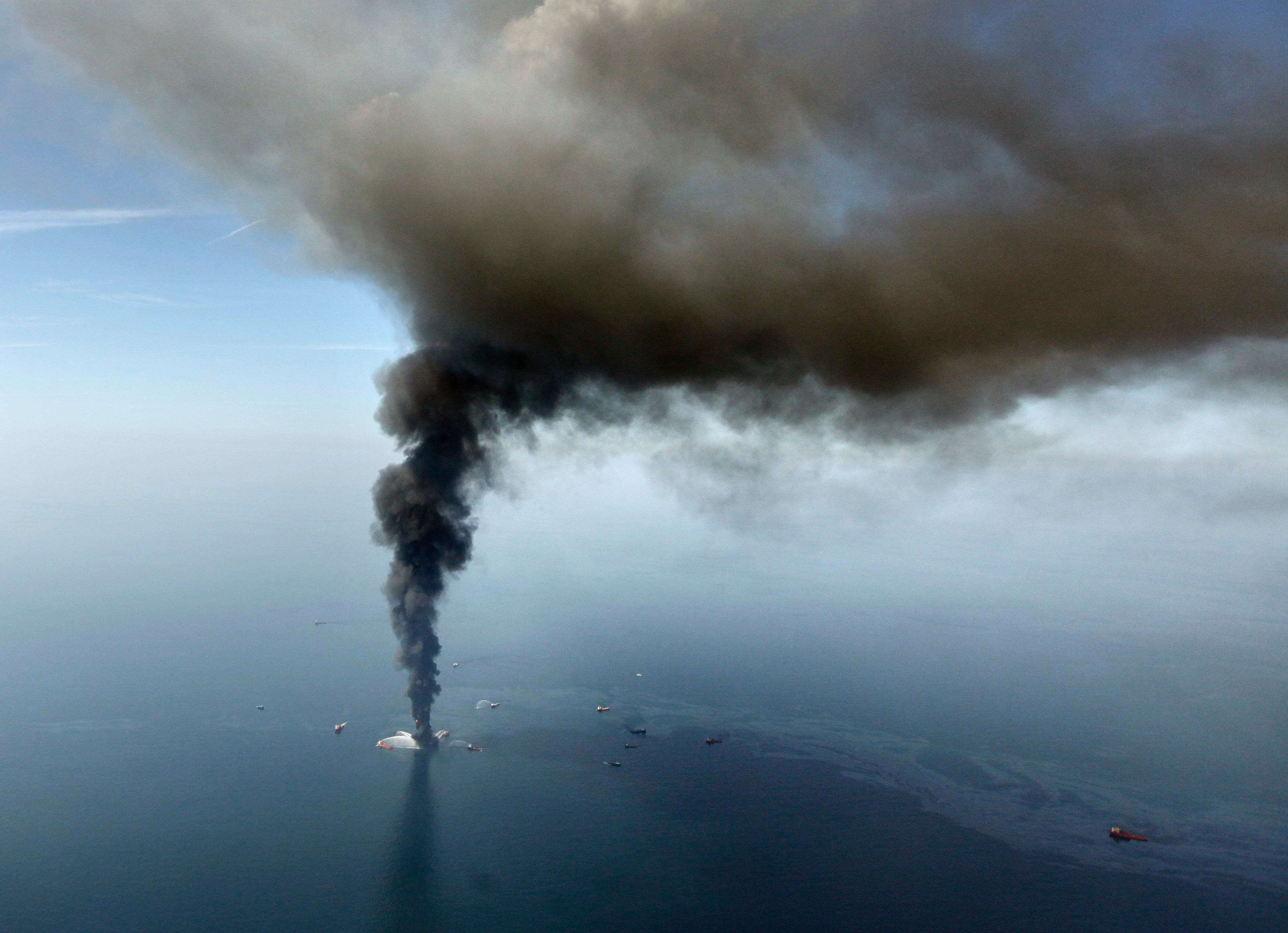 A large plume of smoke rises from BP's Deepwater Horizon offshore oil rig in the Gulf of Mexico on April 21, 2010.