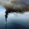 A large plume of smoke rises from BP's Deepwater Horizon offshore oil rig in the Gulf of Mexico on April 21, 2010.