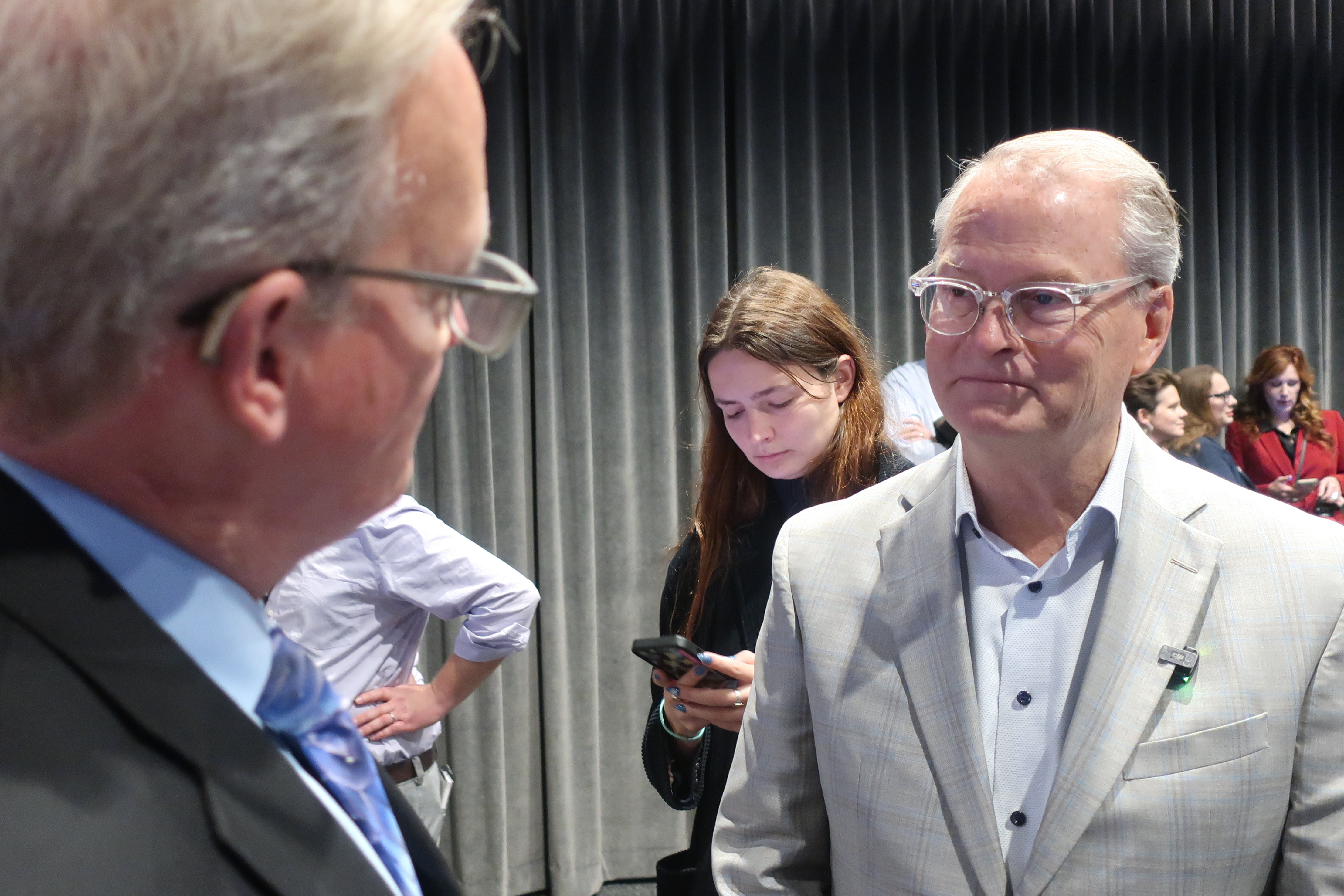 Democratic Senate nominee Adam Hamilton, right, speaks with Curtis Sneden, president and CEO of the Metropolitan Topeka Airport Authority, Oct. 16, 2026, Topeka, Kan.