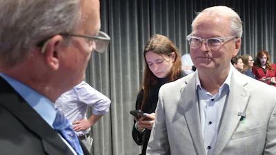 Democratic Senate nominee Adam Hamilton, right, speaks with Curtis Sneden, president and CEO of the Metropolitan Topeka Airport Authority, Oct. 16, 2026, Topeka, Kan.