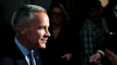 Prime Minister Mark Carney takes questions from journalists as he arrives for a meeting of the federal cabinet on Parliament Hill in Ottawa, Oct. 20, 2026.