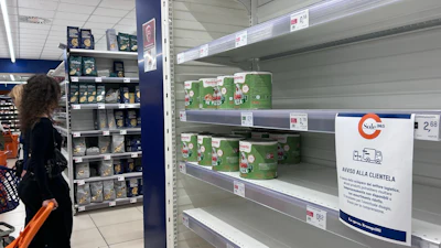 A notice on empty shelves at a supermarket apologizes to customers for the lack of products, Naples, Italy, Oct. 20, 2026.