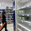 A notice on empty shelves at a supermarket apologizes to customers for the lack of products, Naples, Italy, Oct. 20, 2026.