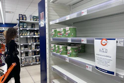 A notice on empty shelves at a supermarket apologizes to customers for the lack of products, Naples, Italy, Oct. 20, 2026.