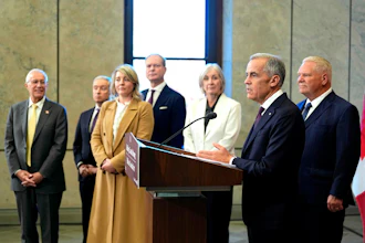 Canada Prime Minister Mark Carney and Ontario Premier Doug Ford, right, are joined by federal and provincial ministers at a joint news conference on Parliament Hill in Ottawa, Oct. 21, 2026.
