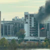 In this image from video, fire and smoke rise from a building attached to Quaker Oats facility in Cedar Rapids, Iowa.