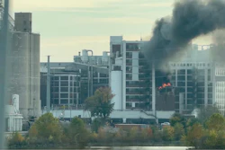 In this image from video, fire and smoke rise from a building attached to Quaker Oats facility in Cedar Rapids, Iowa.