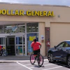 Children ride their bicycles to the Dollar General store, Aug. 21, 2025, Nashua, N.H.