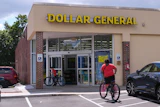 Children ride their bicycles to the Dollar General store, Aug. 21, 2025, Nashua, N.H.