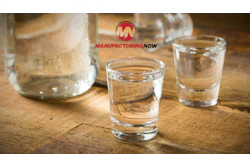 ManufacturingNow logo with glasses of water on wooden surface