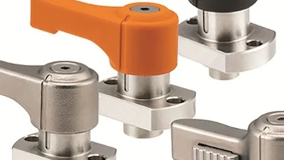 Industrial toggle clamps with stainless steel and colored handles in orange and black
